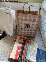 Paper bags labeled ‘Topographic Maps’ and ‘International Maps 1940s-1950s’ containing vintage maps