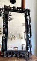 Front view of the vintage brutalist style mirror showing the entire rectangular frame with geometric block shapes and textured surfaces.
