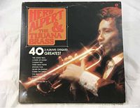 Front cover of Herb Alpert & The Tijuana Brass 2 Album Greatest Hits vinyl LP set showing Herb Alpert playing trumpet and the album title.