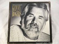 Front cover of Kenny Rogers 'We've Got Tonight' vinyl LP record album with a black and white close-up portrait of Kenny Rogers.