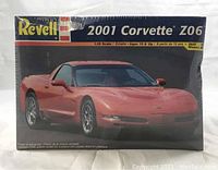 Front view of unopened Revell model kit box showing red 2001 Corvette Z06 image and branding.