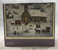 Front of puzzle box showing winter church scene and branding