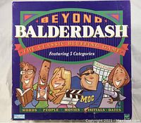 Front of the Beyond Balderdash game box showing title and featured categories with cartoon illustrations.