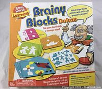Front box image showing brand, Brainy Blocks Deluxe name, and colorful activity cards illustrations