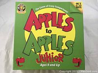 Front of Apples to Apples Junior game box showing title, age recommendation, and branding.