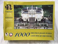Image of the front of the puzzle box showing the chateau image and puzzle details