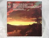 Front cover of the album showing landscape artwork with text listing composers and conductor Leopold Stokowski.