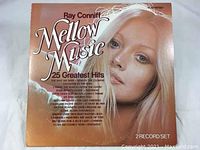 Front cover of the album sleeve showing artist name Ray Conniff, album name Mellow Music 25 Greatest Hits with portrait of a blonde woman.