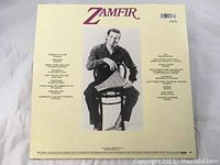 Back cover of the Zamfir vinyl record album showing track list and a photo of Zamfir holding a pan flute.