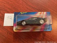 Front view of Hot Wheels Ferrari Testarossa in blister pack with visible cut card edges.