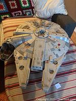 Top view of entire Millennium Falcon model showing missing cockpit plastic and detailed surface.