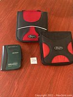 Sony FM/AM Walkman, two Braxton CD cases on wooden surface with lot number