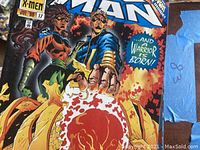 Close-up of X-Men comic book issue 17 cover showing character art and title.