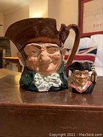 Both Royal Doulton Toby jugs together, showing overall size and appearance.
