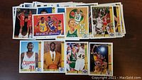 Photo showing a stacked spread of 1991-92 Upper Deck basketball cards including rookie cards and star players like Shaquille O'Neal and Magic Johnson.