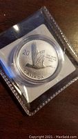 Photo of the 2014 Canada Goose silver coin showing the goose design and coin details.