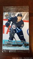 Front of the sealed Kyle Connor Young Guns rookie card showing the player in Winnipeg Jets uniform.