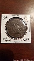 Obverse side of the 1852 Bank of Upper Canada one penny token showing the mounted knight design.