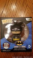Front view of sealed Funko Dorbz Batman Specialty Series vinyl figure inside box showing figure and branding.
