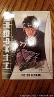 Front view of 2009-10 Upper Deck Victor Hedman MVP Rookie Card with 'ROOKIE' text and player image.
