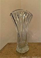 Front photo of the clear crystal vase showing geometric vertical cut design and flared top.