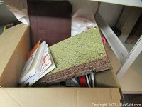 Box showing various miscellaneous books, papers and items