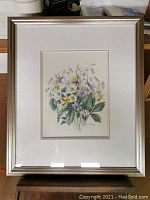 Framed watercolour artwork showing the floral bouquet with signature E. Sartain visible at the lower right.