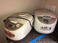 Both appliances placed side by side on a counter showing overall size and condition.