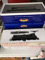 Stacked HO scale engine kit boxes, Genesis blue box on top and white/red Pennsylvania kit box below