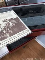 Original foam tray showing one locomotive chassis and manual cover.