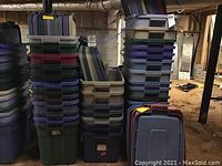 Front view of multiple stacks of plastic storage totes in various colors