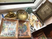 Photo showing assortment of vases, bowls, brass items, framed mosaic art, and ceramic pieces.