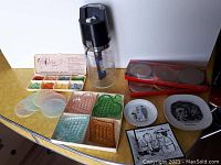 Photo of the Drink-O-Matic mixer, glass card suits dishes, coasters and vintage glass dishes