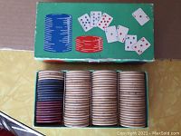 Top and open view of the vintage poker chip box showing stacks of plain clay poker chips in black, maroon, and beige/light tan colors.