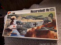 Top view of the Messerschmitt Me 109E model kit box featuring detailed combat artwork with historic Luftwaffe aircraft markings.