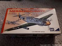 Box top showing artwork of the Messerschmitt Bf 109 G-6 aircraft in flight with markings and scale information