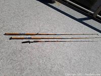 Three fishing rods laid side by side displaying overall length and condition.