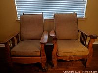 Two oak Morris chairs side by side showing overall design and dimensions