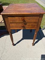 Front view of the Sheraton two drawer stand showing finish, drawers, and turned leg style.