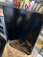 Front view of the 42 inch Sharp LED TV showing the screen and frame.