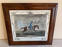 Full frontal image of the framed aquatint engraving showing the horse and rider in a dark wood frame.
