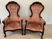 Front view of two Victorian-style sitting chairs