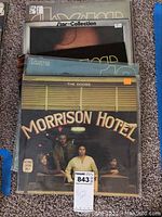 Five Doors vinyl albums stacked showing Morrison Hotel first with visible album covers behind it.