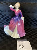 Front view of Royal Doulton Melissa figurine showing detailed dress color gradient and pose.