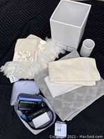 Overview of all bathroom accessories and blood pressure cuff with case.