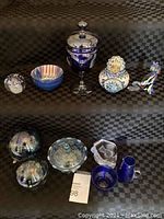 Full view of lot items arranged on black checkered cloth background showing all small and large items