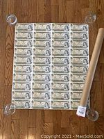 Full uncut sheet front view showing all notes.