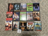 Photo showing 15 DVD covers including titles like Dumb and Dumber, Ace Ventura Pet Detective, Rushmore, and Kung Fu Hustle.