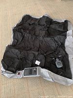 Coleman air mattress laid out flat, showing control panel area and valve for inflation/deflation.