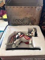 Horse of a Different Color original box with artistic horse illustration and text.